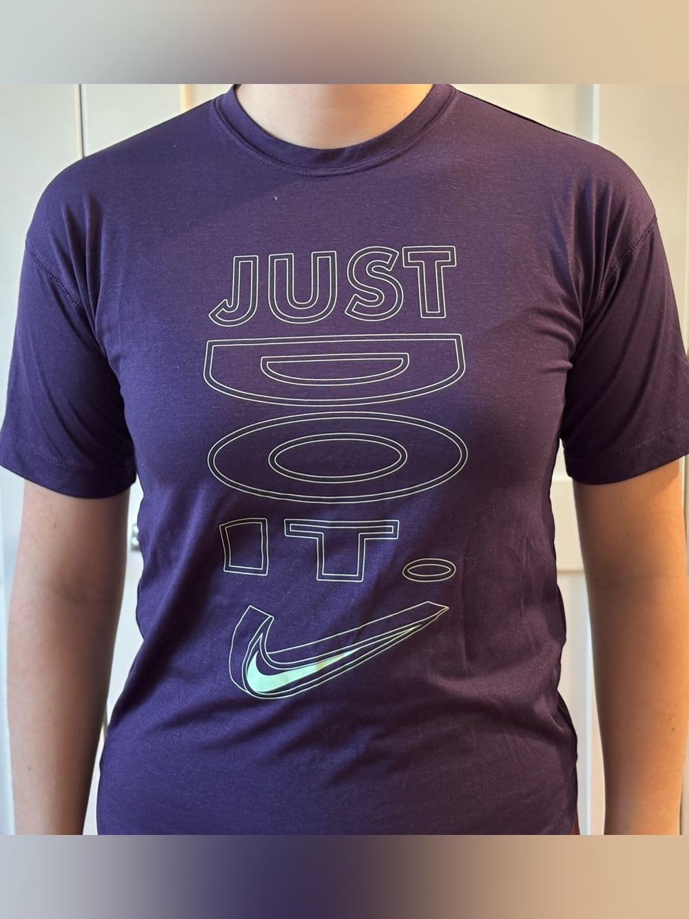 Nike Purple Tee with Mint Swoosh and White Outline Graphic